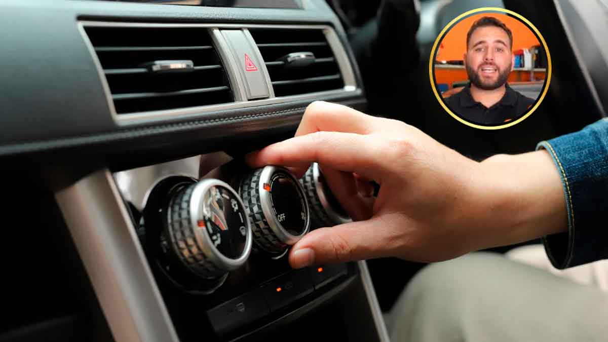 Conductor ajustando la calefacción del coche mientras un mecánico explica su impacto en el consumo