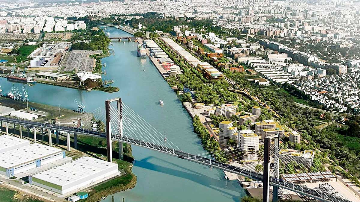 Vista aérea del proyecto del Distrito Portuario de Sevilla junto al río Guadalquivir con edificios y parques.